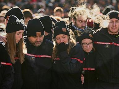 Hundreds march in silence to honor victims of Swiss bar fire that left 40 dead