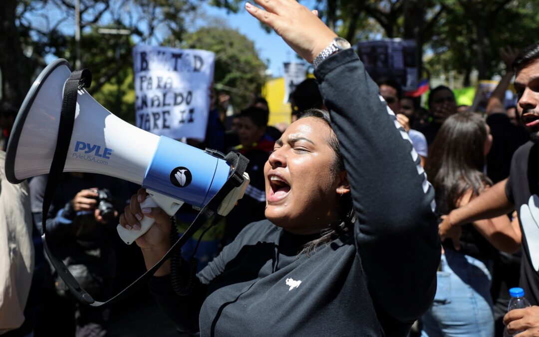 Protesters march in Venezuela as National Assembly weighs amnesty bill
