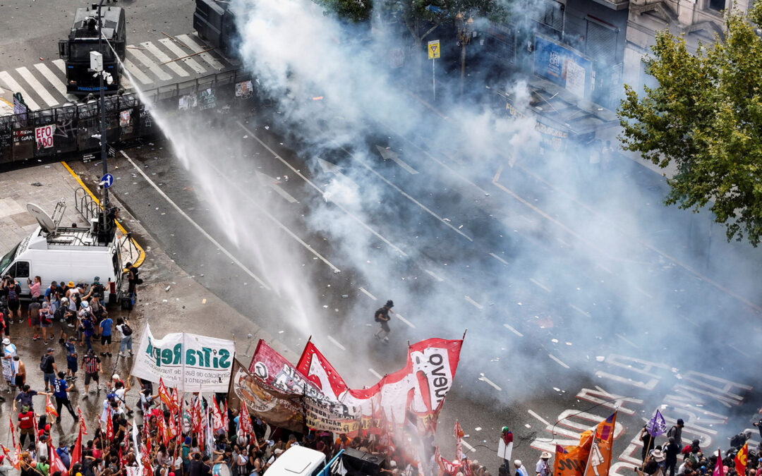 Argentinian security forces fire water cannon and tear gas at protesters