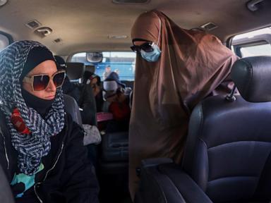 Australians with alleged IS ties are turned back after departing Syrian camp for repatriation