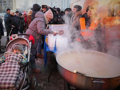 In the Ukrainian capital, a mother struggles to keep her children warm and fed amid power outages