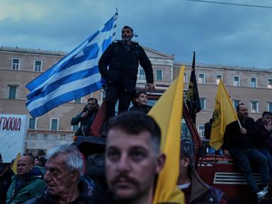 Angry Greek farmers converge on parliament with tractors in overnight protest rally