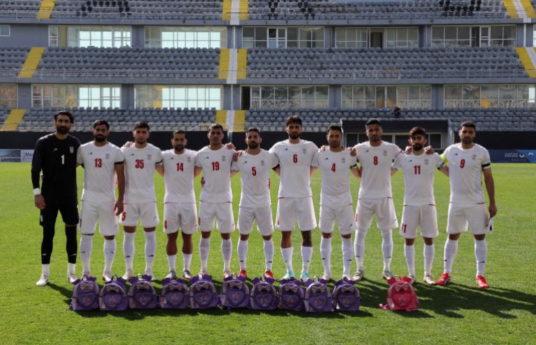 Iran footballers pay tribute to victims of school strike at start of war