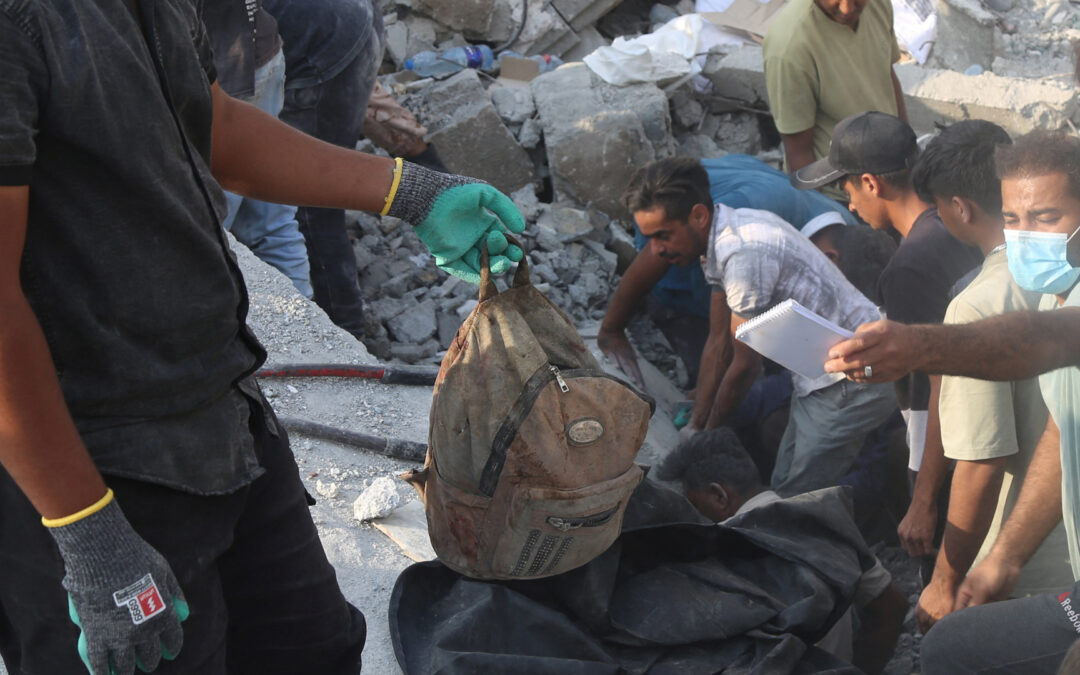 Man accuses Israel of war crimes as he holds remains of girl killed in Iran