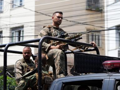 Rio police pull 4 officers from street duty in a probe into a deadly raid