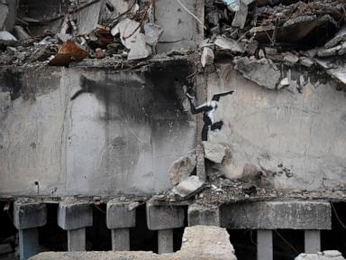 Media may have unmasked Banksy — again. Some fans are angered, dealers aren’t ruffled