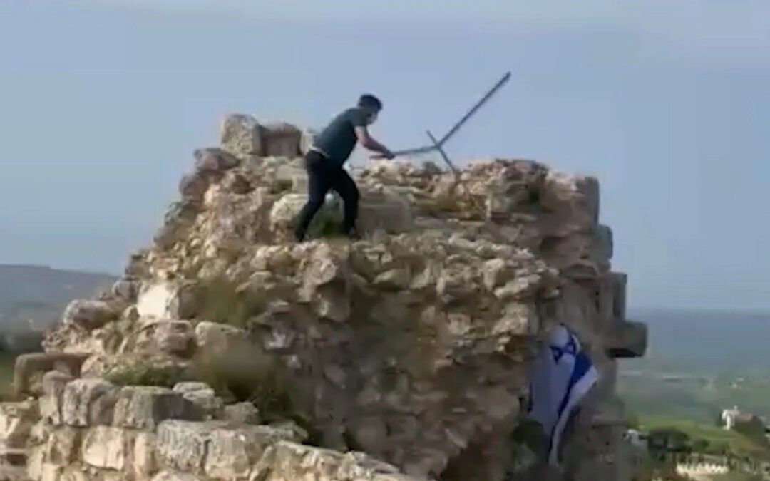 Lebanese man removes Israeli flag from castle in southern Lebanon