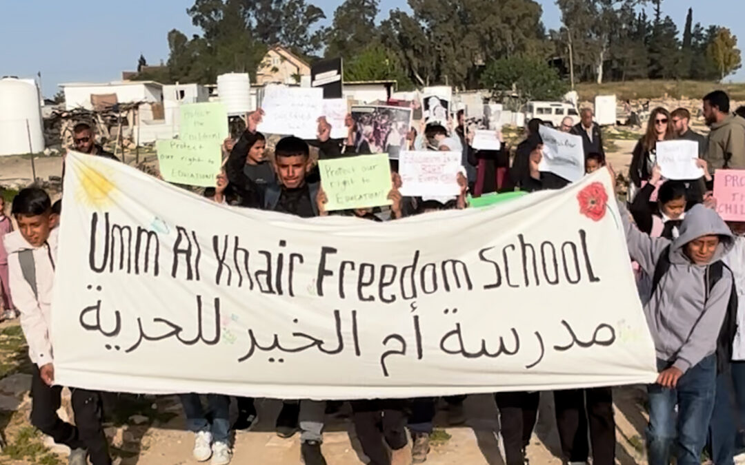 Palestinian children protest against siege on their school