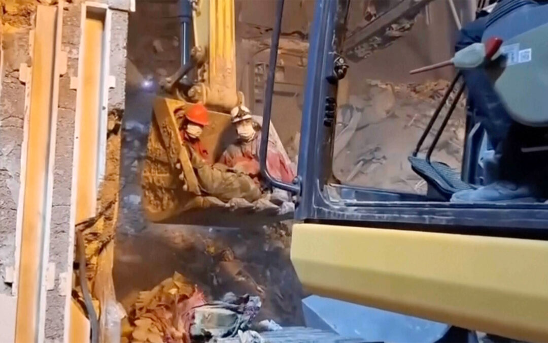 Rescuers search for survivors after strikes hit homes in Iran