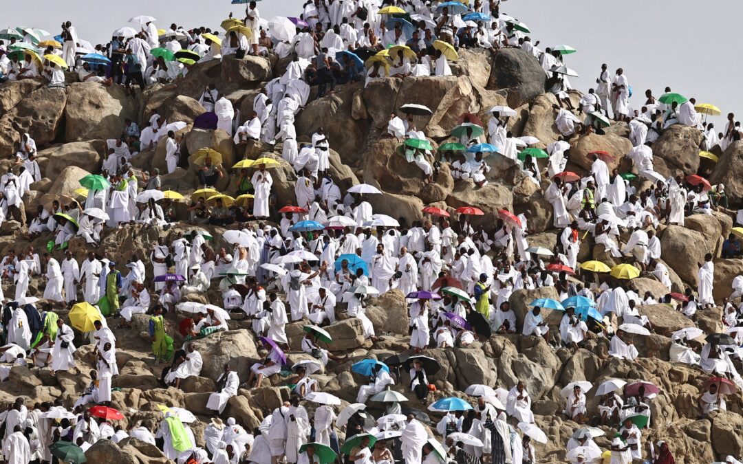Hajj pilgrims gather at Mount Arafat under scorching desert sun