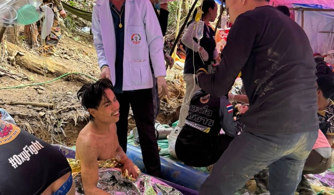 Rescuers free four more men from flooded Laos cave, two still missing