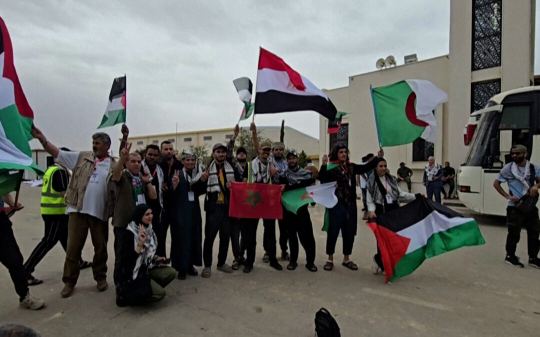 Activists take part in a land convoy from Libya to bring aid to Gaza