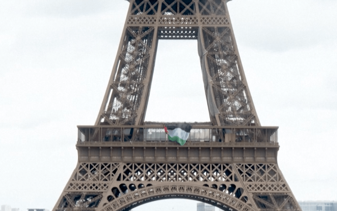 Activists hang Palestinian flag on the Eiffel Tower for Nakba Day