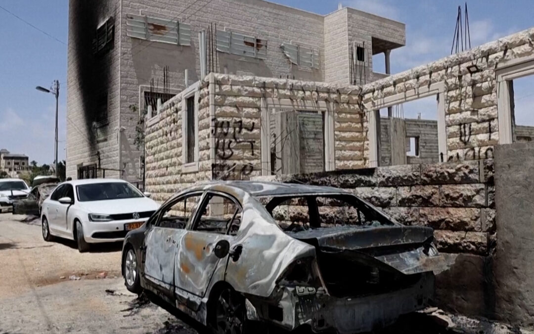 Israeli settlers burn vehicles, install caravans in occupied West Bank