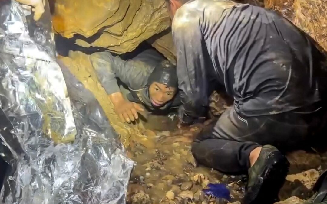 Rescuers race to save two people still trapped in cave in Laos