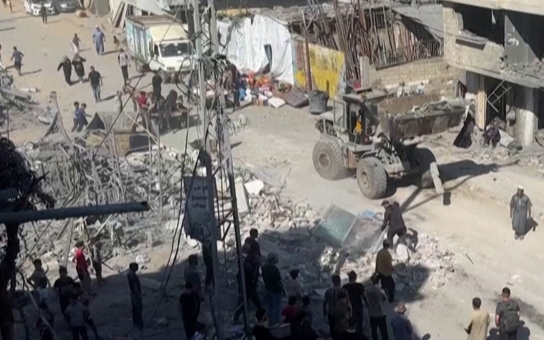Families clear rubble after overnight Israeli strikes in Gaza