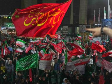 Iran says it is suspending commitments to interim deal with US as the two exchange attacks