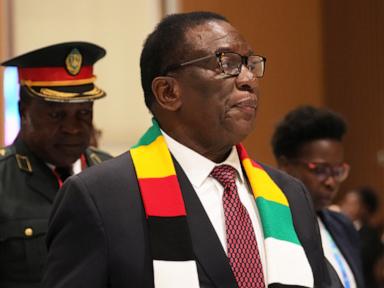 Zimbabwe’s 83-year-old president signs law to delay elections and extend his own term