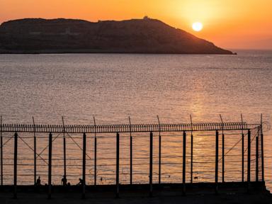 Hundreds of migrants swim from Morocco to the Spanish territory of Ceuta