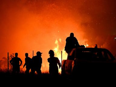 Hundreds of firefighters battle a wildfire in Portugal, while Greek authorities warn of toxic smoke