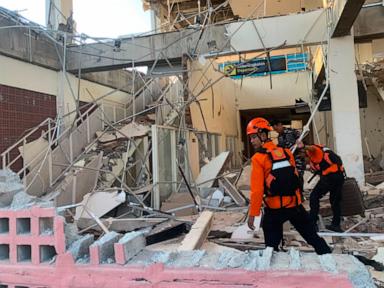 Rescuers dig through rubble and landslides after Indonesia quake kills 47
