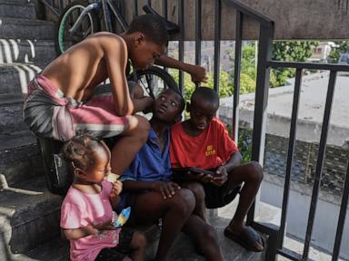 First group of deportees arrives in troubled Haiti after US ends TPS program