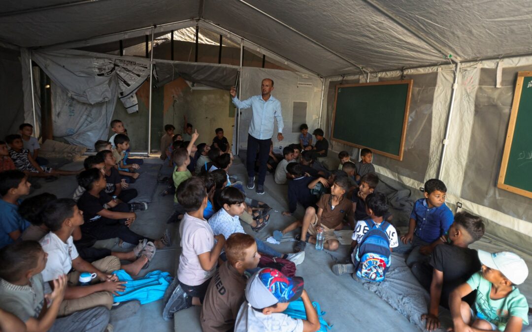 Photos: Gaza’s children return to class in tents and ruins