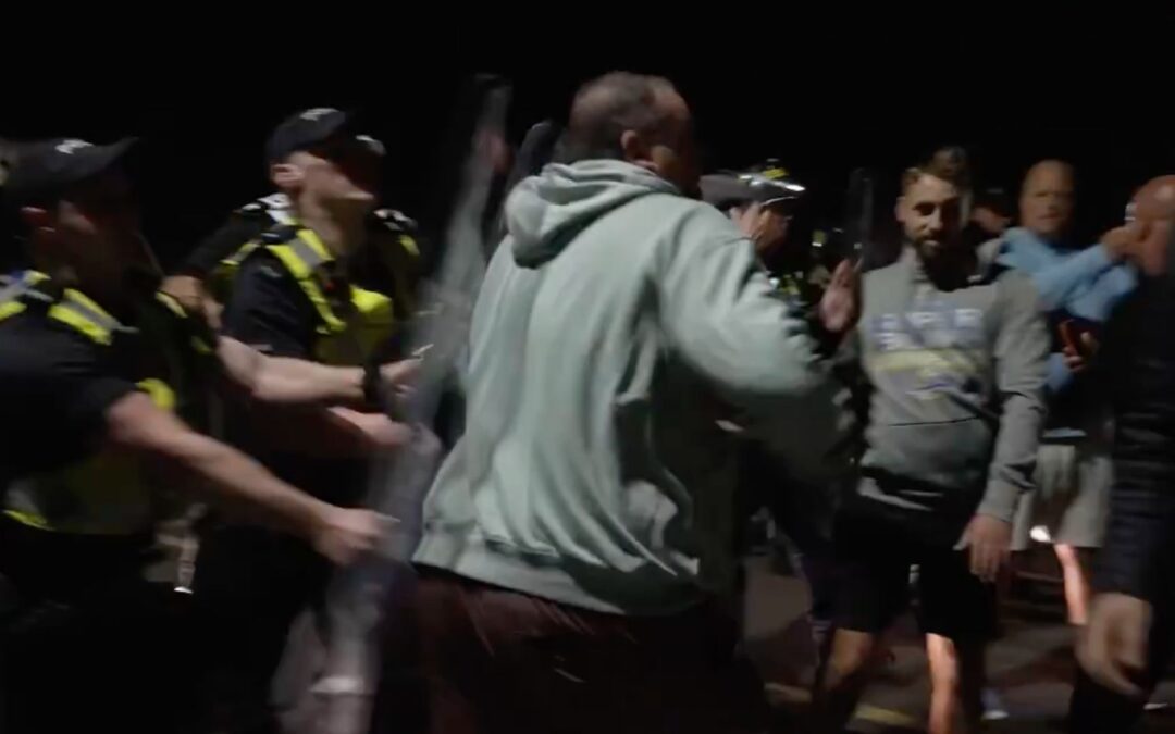 Anti-immigration protesters clash with police in UK after boat arrival
