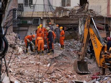 Rescuers search for people trapped in a New Delhi building collapse as death toll rises to 6