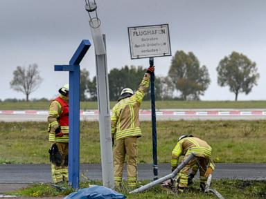 German authorities investigate a hole cut into a fence at Leipzig airport